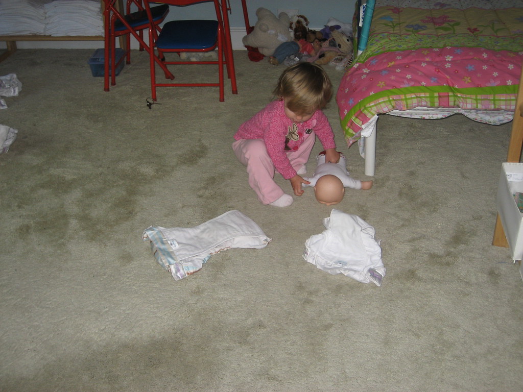 marin putting diapers on her baby Bo and Brynne Flickr