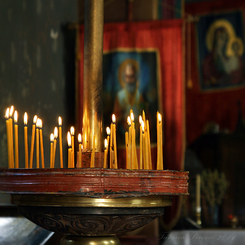 Calling upon the Mediators. Orthodox beeswax candles. Prayer. a photo