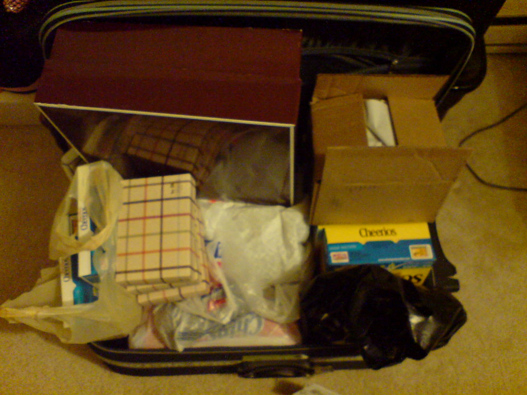 Overflowing Luggage RexOink Flickr
