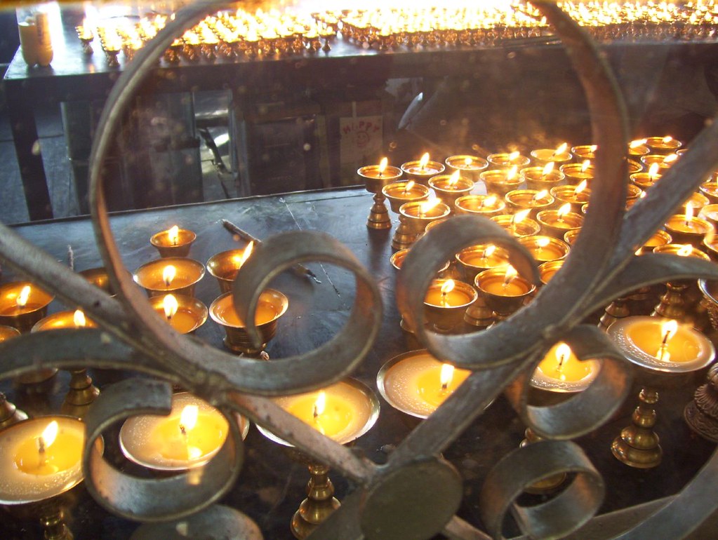 Buddhist prayer candles by Emily Hansen Ian MacKenzie Flickr