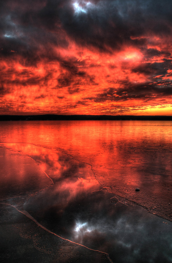 Fire & Ice A lightly frozen Chautauqua Lake reflects the l… Flickr