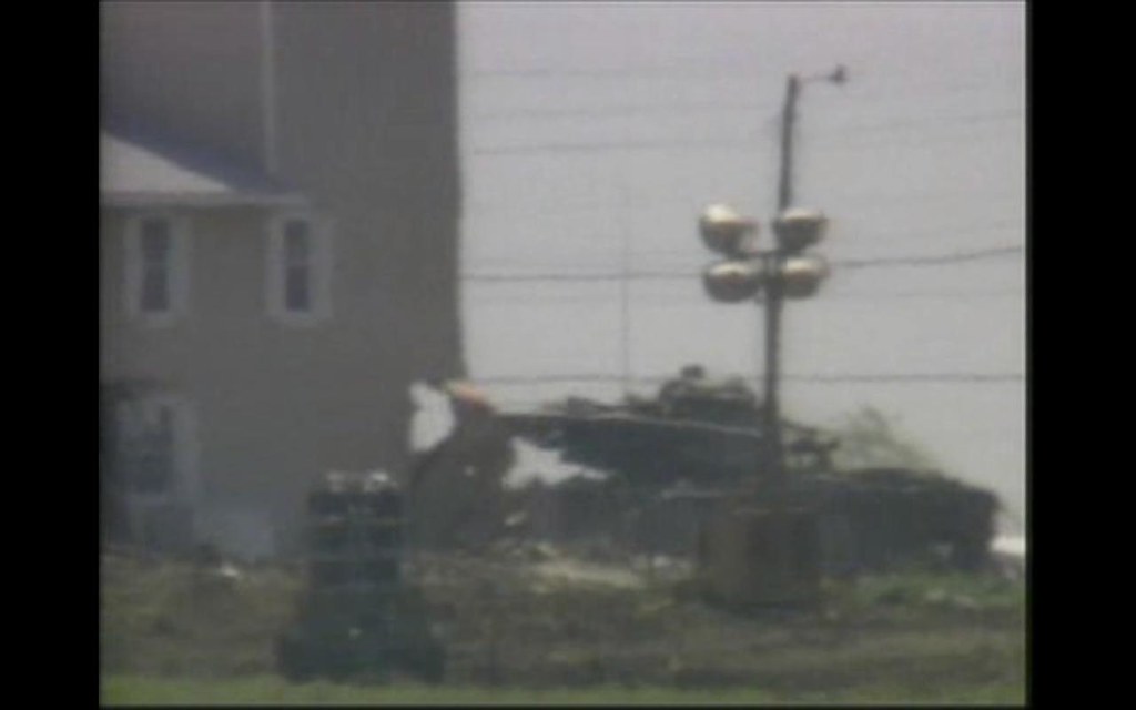 waco tank taring a hole in the side of compound to pump in… Flickr