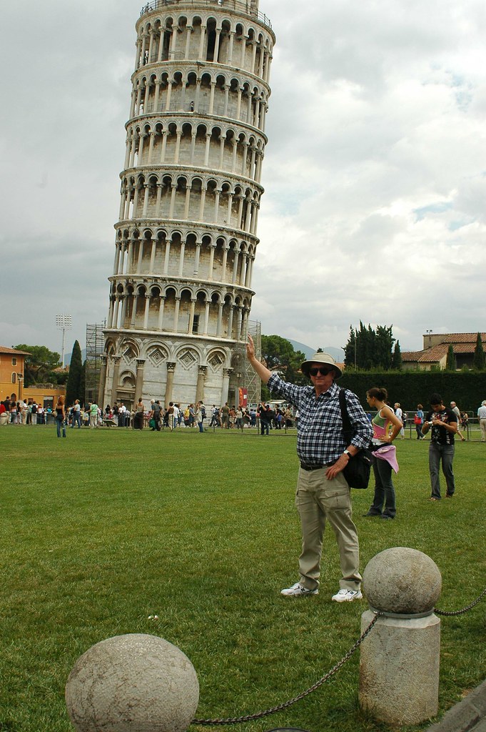Peter holding up the leaning Tower of Pisa All in a days w… Flickr