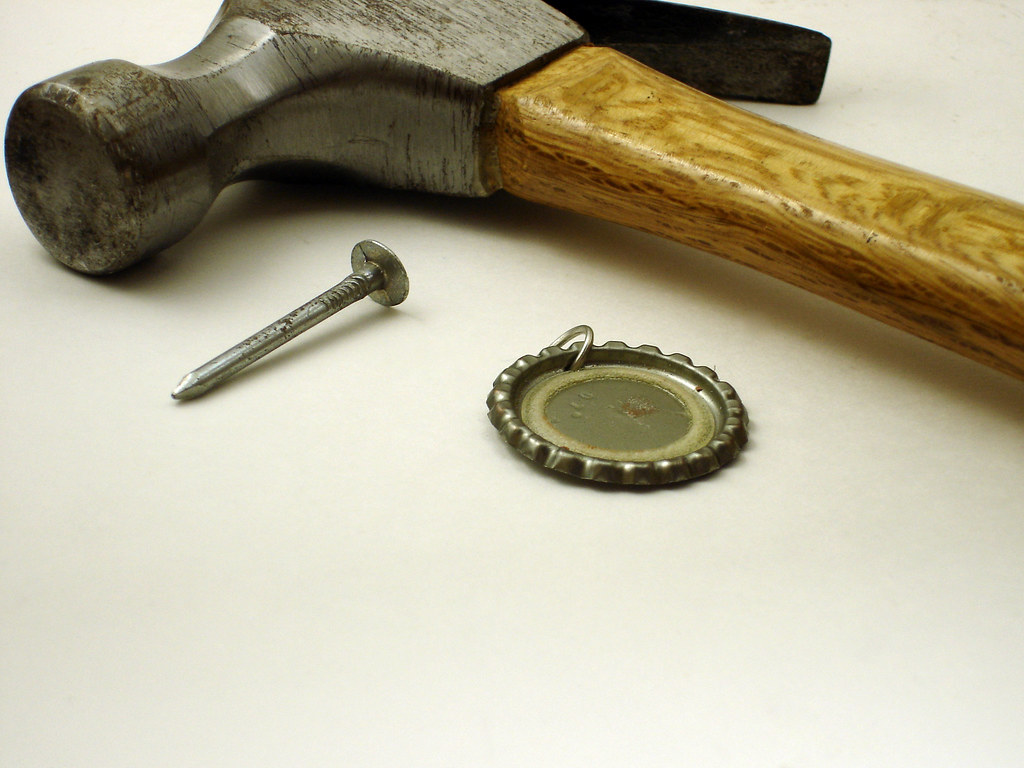 Step 2 Punch Hole in Bottle Cap Use a hammer & nail to pu… Flickr