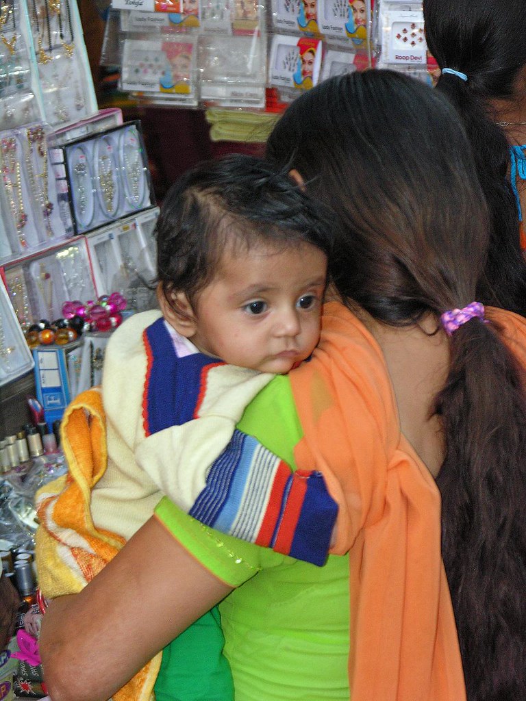 India5234 A mother and her baby shopping at one of the sm… Flickr