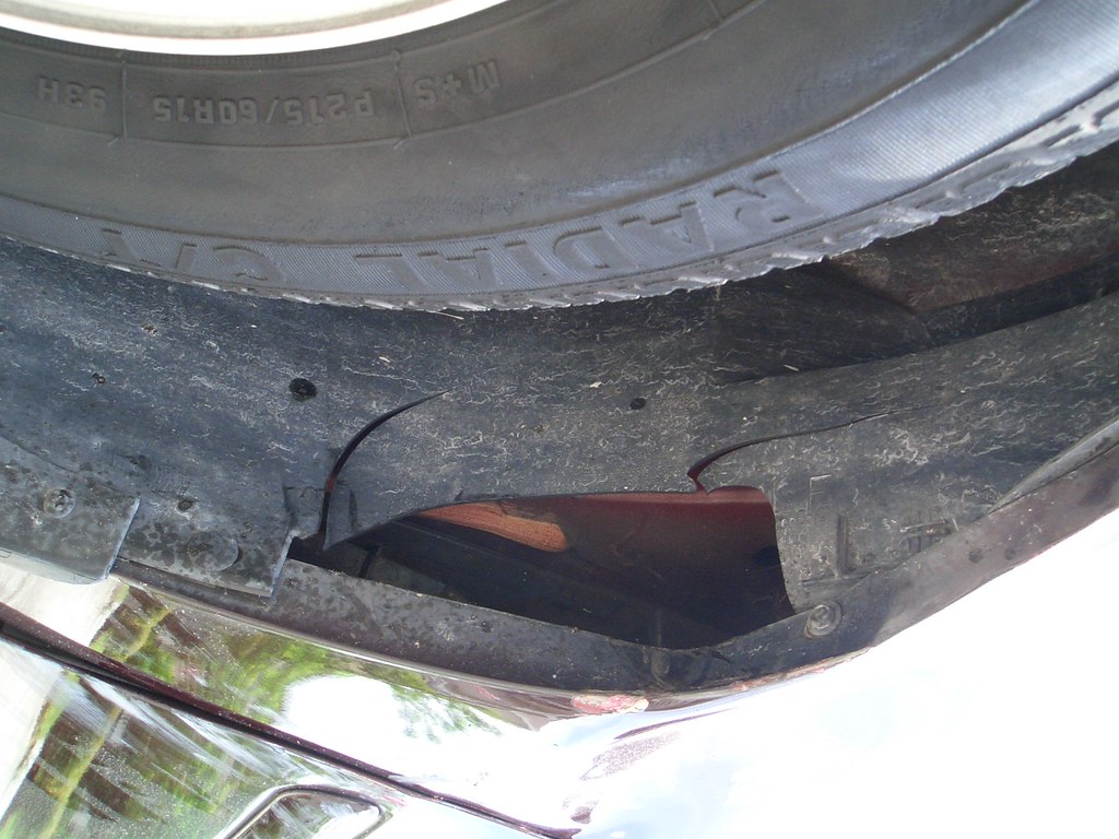 CIMG0483.JPG Damage to driver's side front tire wheel well… Mike