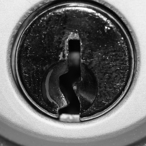 Lock Key Hole A black and white macro shot of a key hole.… Bryan