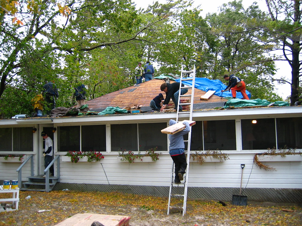 IMG_4719.jpg Roofing the cottage in an October gale. Paul Paquette
