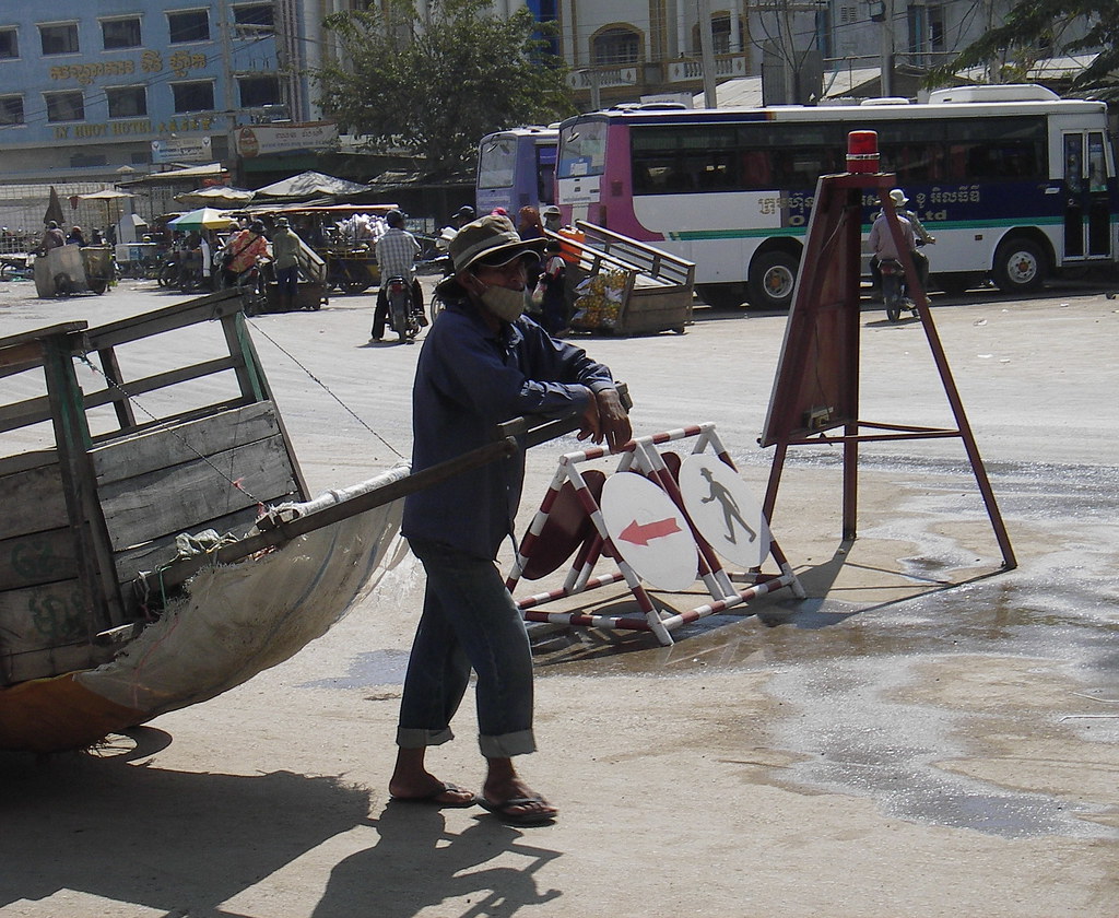 Cambodian labourer Workers move luggage for travellers at … Flickr