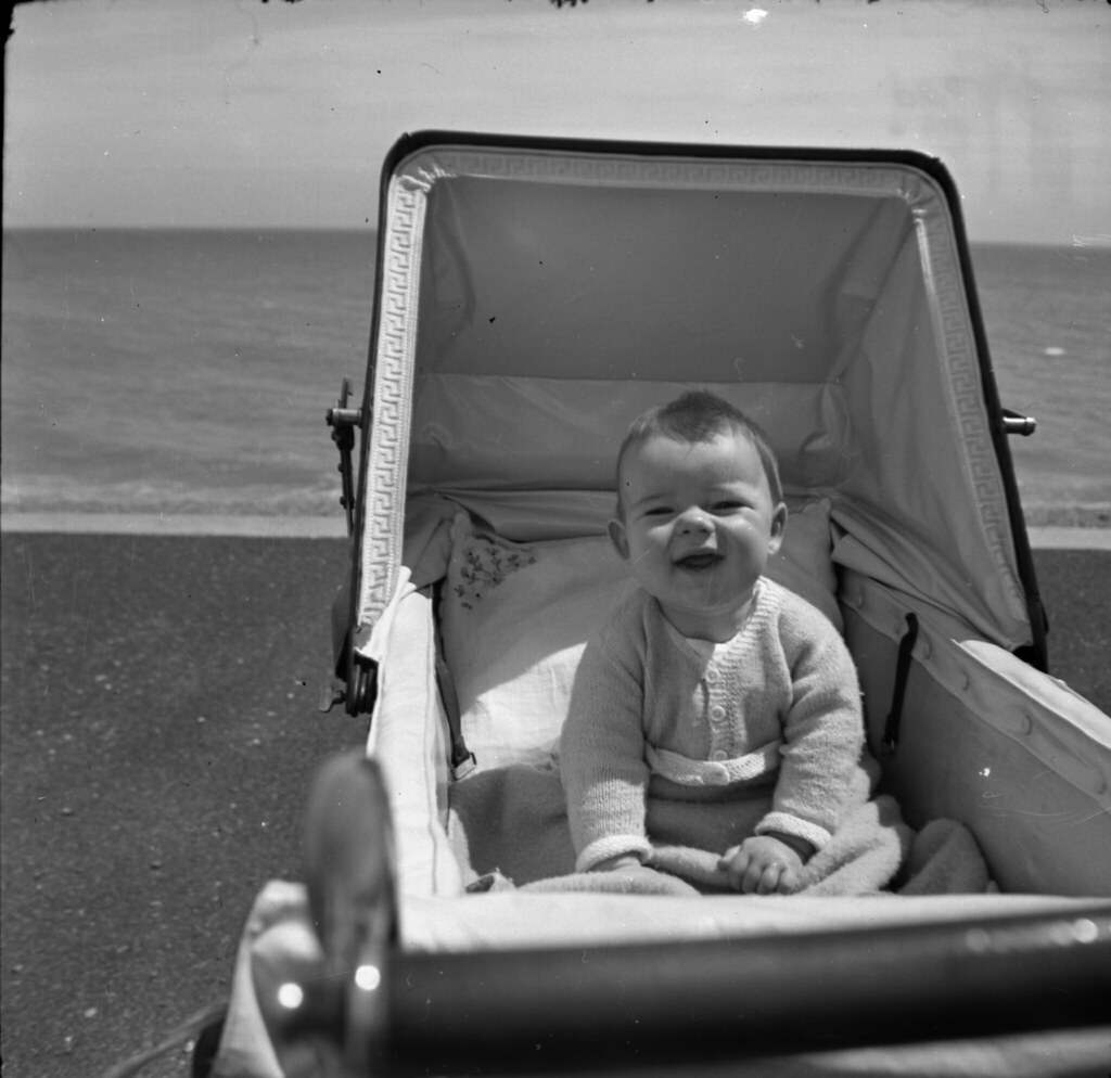 baby in pram on beach Peter Christian Flickr