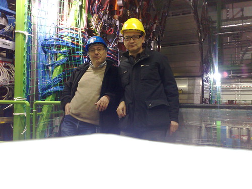A CERN worker and a visitor after a tough day with CMS exp… Flickr