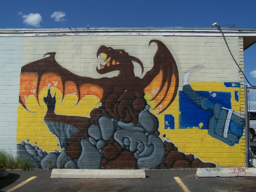 Brown Dragon on wall of auto parts store, Tucson, AZ Robert Hart Flickr
