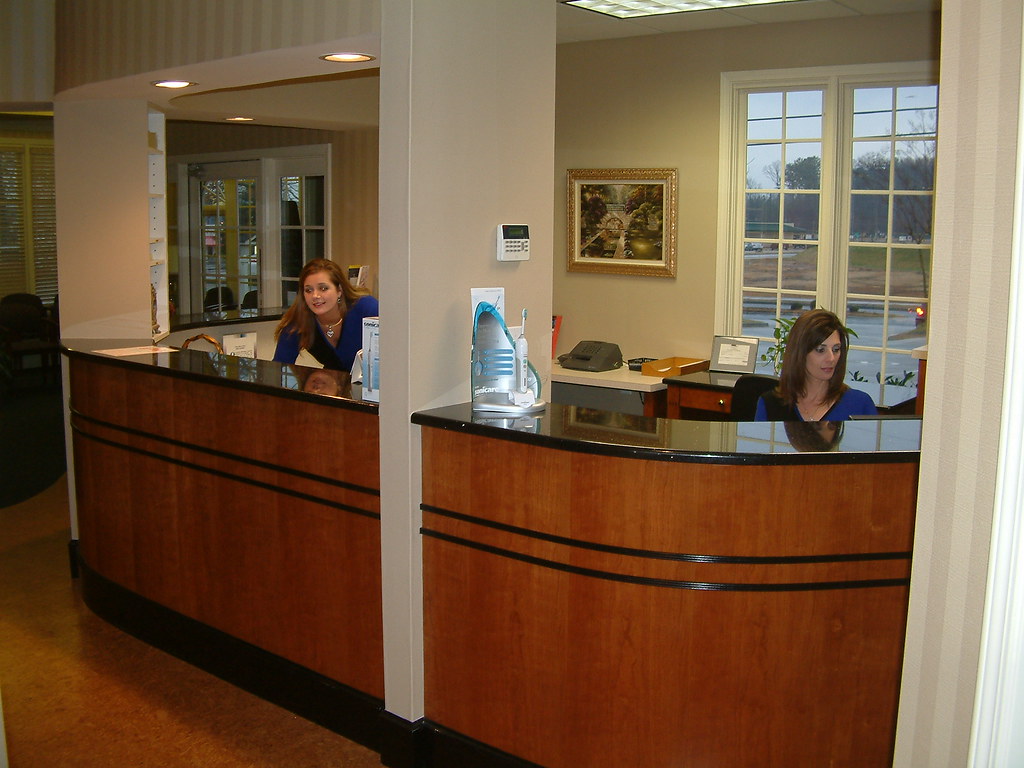 Our friendly front desk staff The smiling front desk at De… Flickr