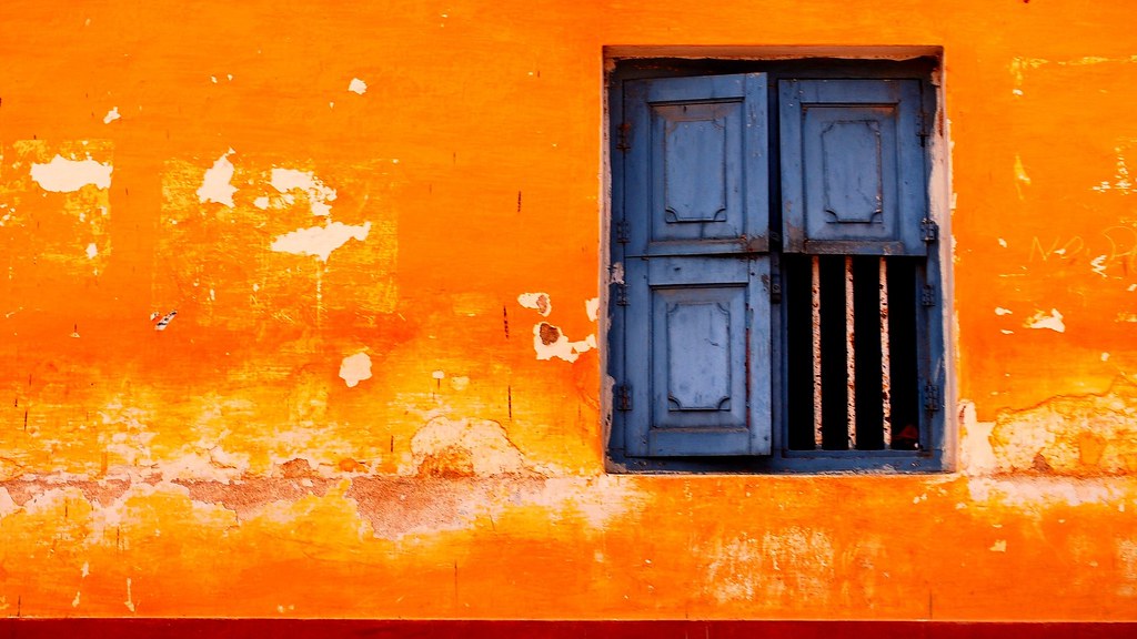 The window Blue window, orange wall in a village near Mang… Flickr