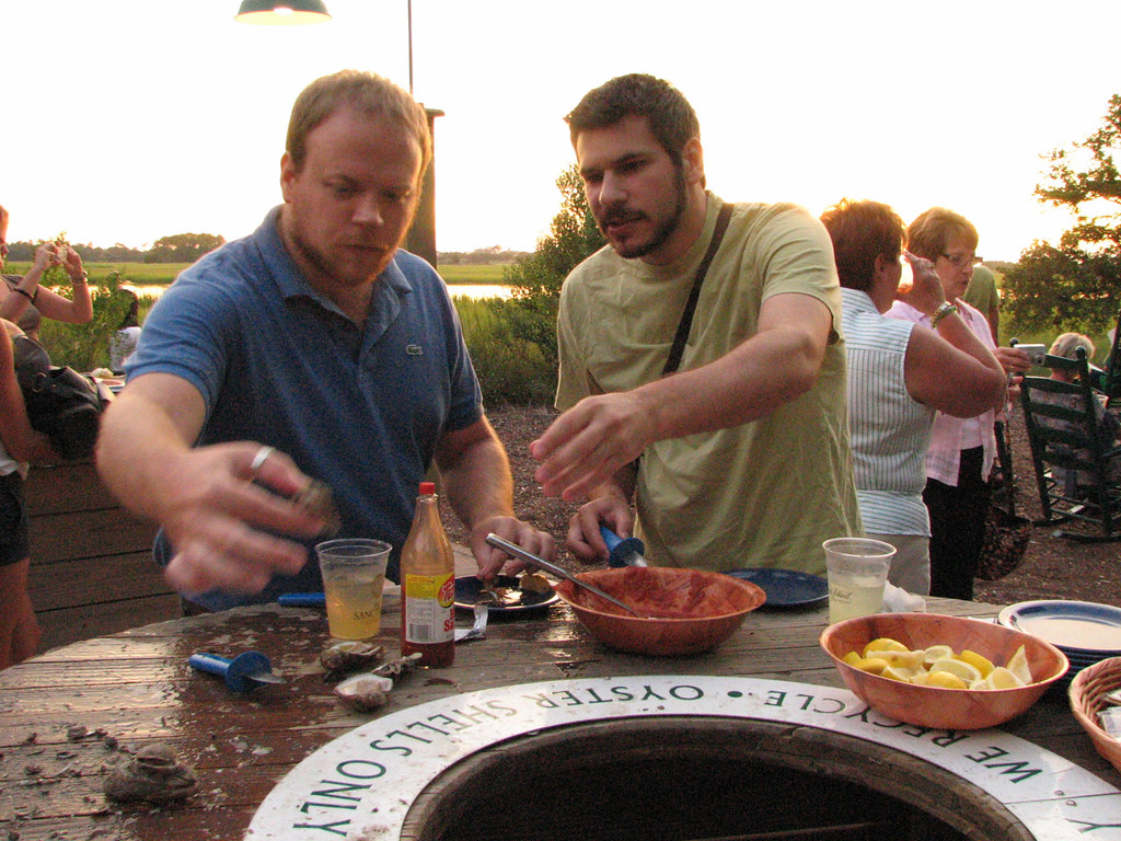Mingo Point Oyster Roast Dan and Michael break open some r… Flickr
