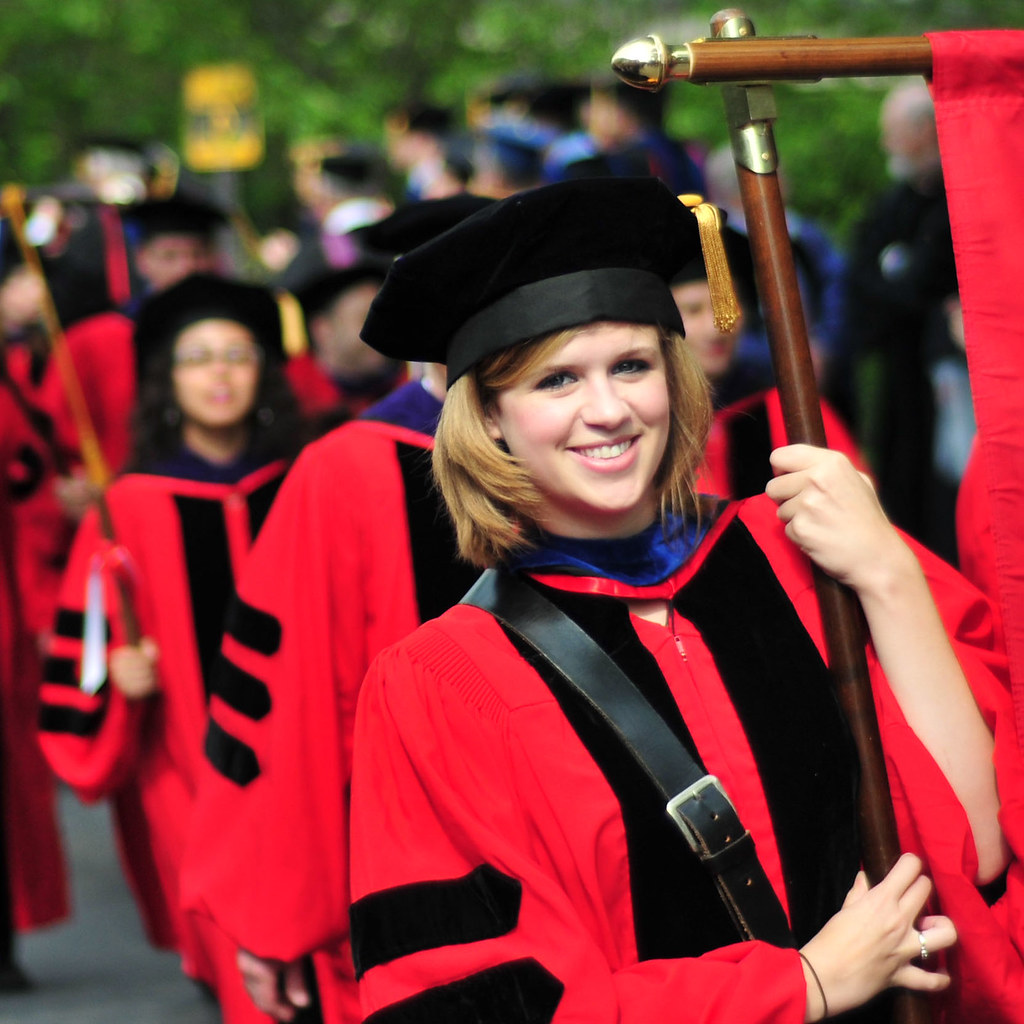 Juris Doctors A Cornell Law Graduate carries her College's… Flickr