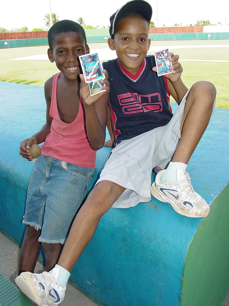 Kids Brandish Baseball Cards at Stadium San Pedro de Macoris