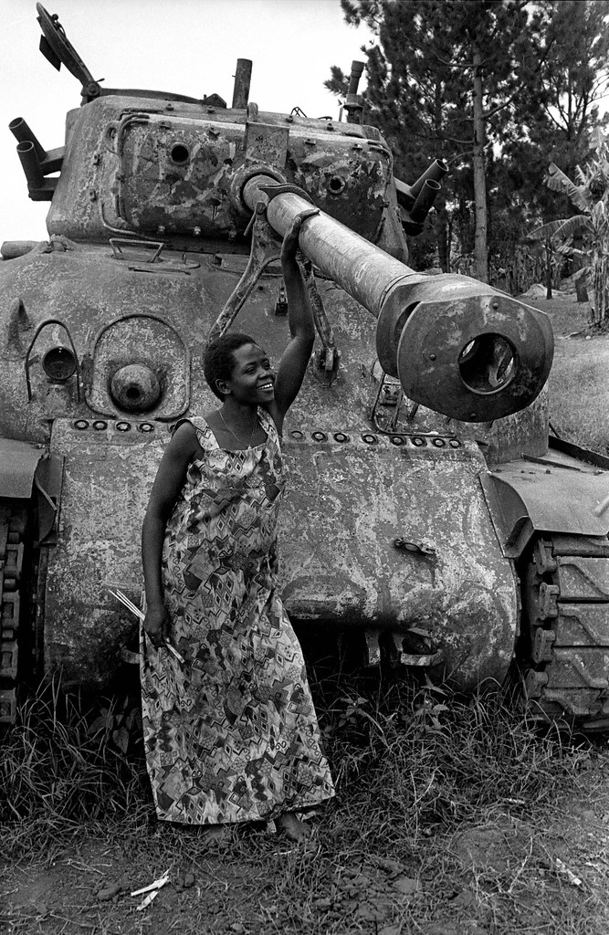 Pregnant woman with abandoned tank An expectant mother pos… Flickr