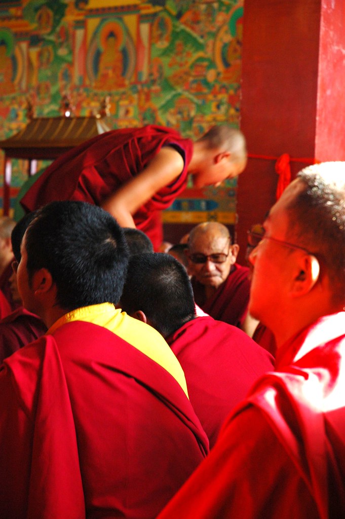 Young monk serving older monks, monks getting prepared for… Flickr