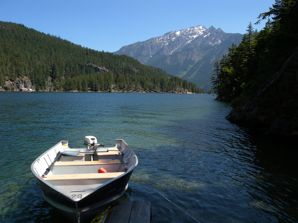 ross lake paradise a fishing boat, a large lake, a big mou… Flickr