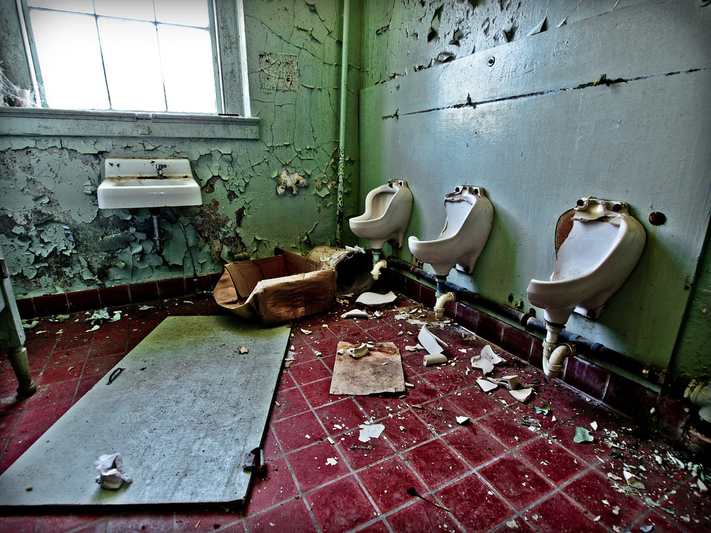 Bathroom Break The now destroyed bathrooms in an abandoned… Flickr