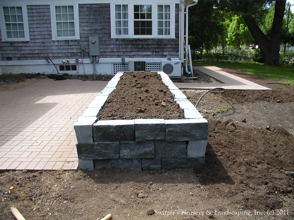 Clay Paver Dinning Patio with Natural Stone Raised Planter and Cedar