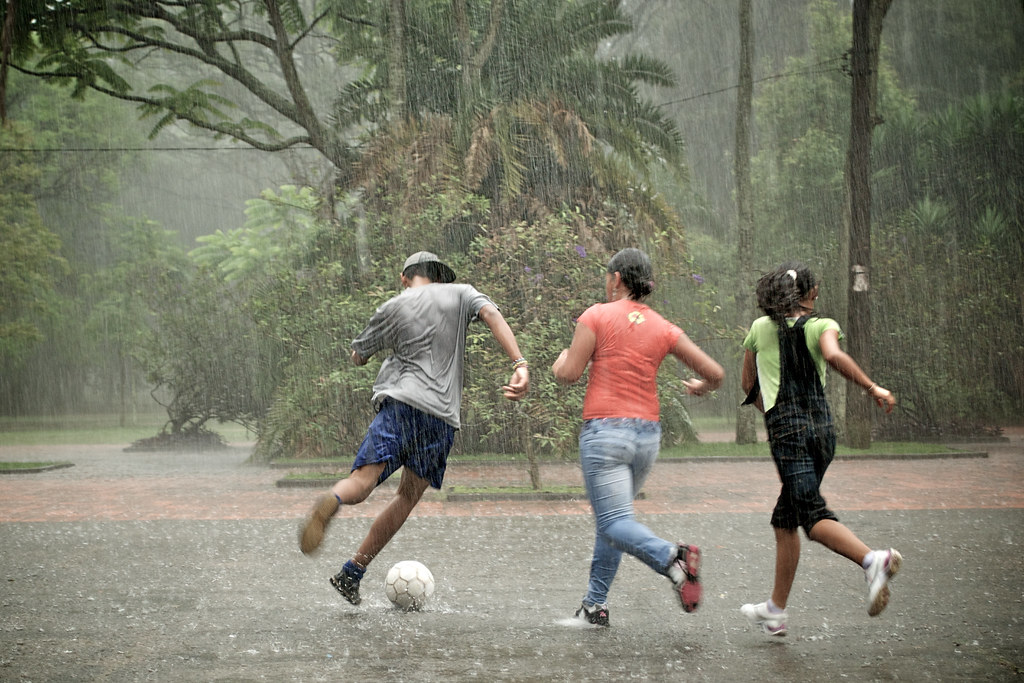 Teenagers playing soccer in the rain Parque do Ibirapuera … Flickr