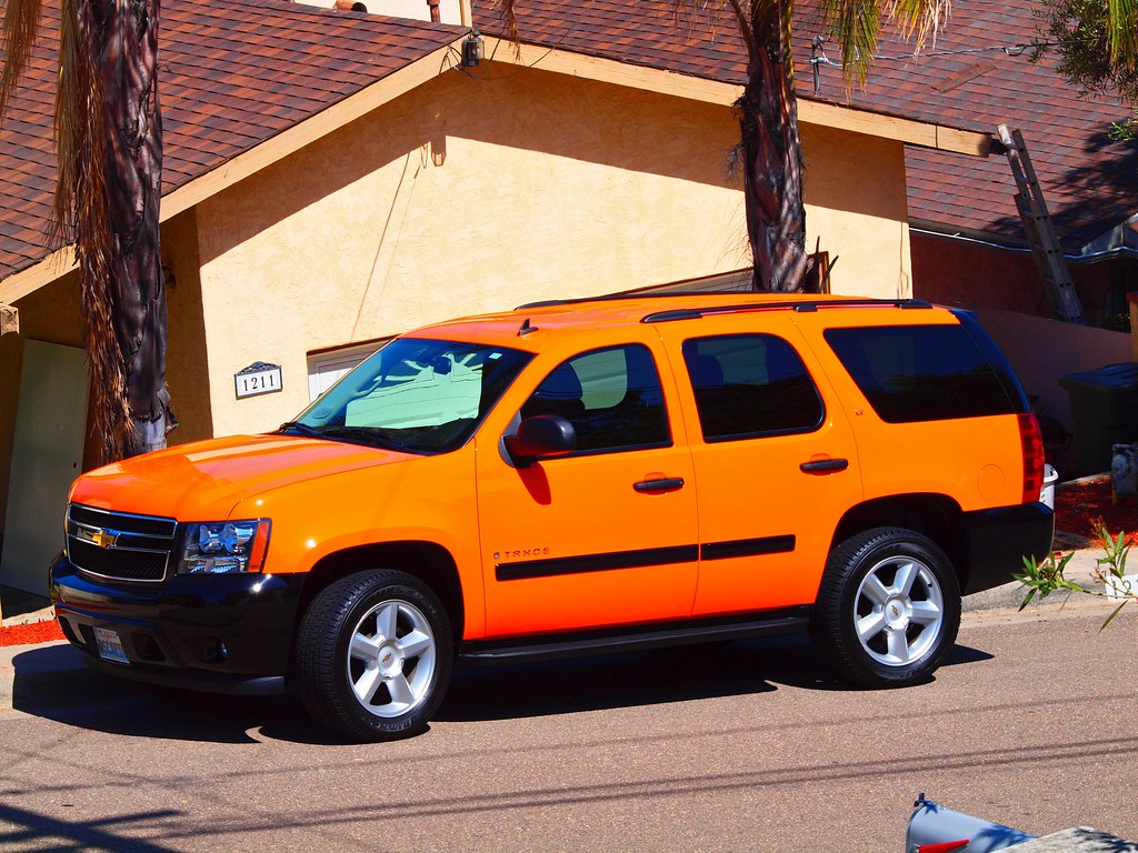Really Orange Took a shot of our neighbors orange SUV with… Flickr