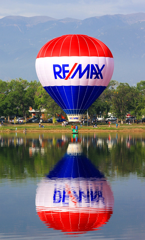 The ReMax Real Estate hot air balloon dipping into Prospect Lake