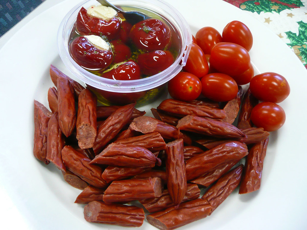 Salami sticks, cherry tomatoes and stuffed baby capsicum Flickr