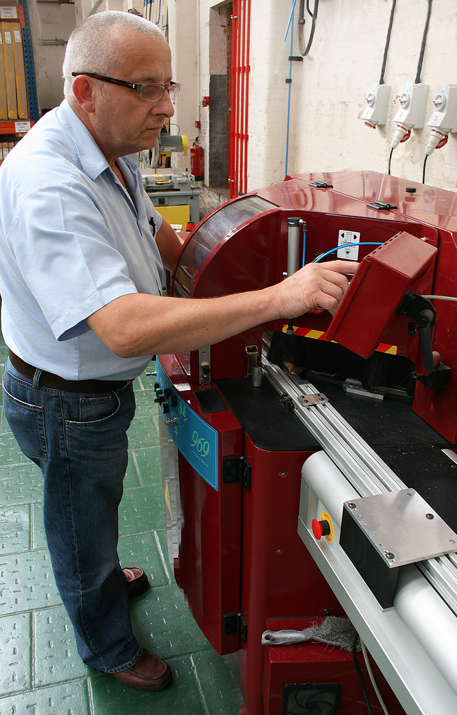 John, cutting moulding for our new Chop Service LION Picture Framing