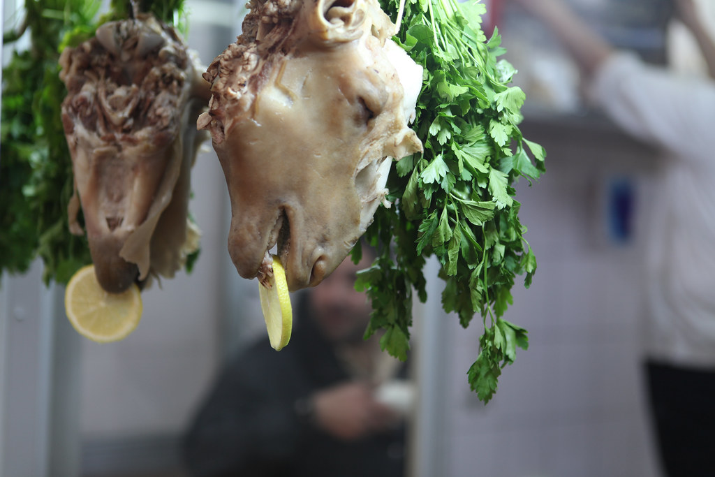 lamb heads, lemons and coriander on display at a butchers … Flickr