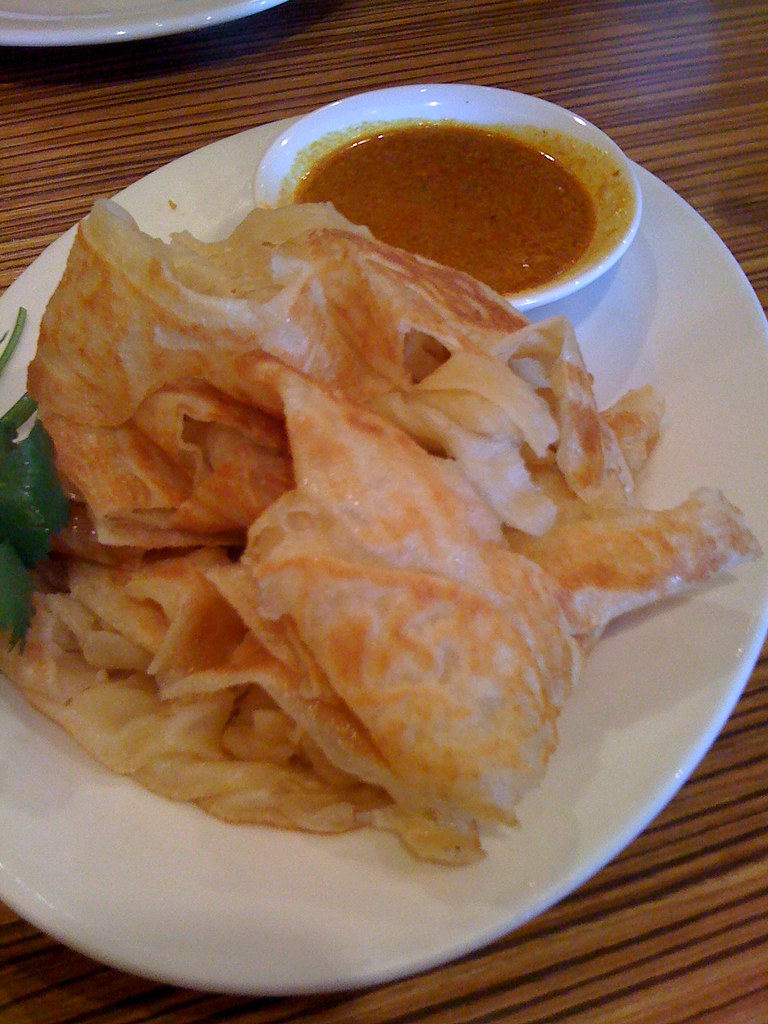 Puffy, soft, addictive Malaysian roti with curry sauce fro… Flickr