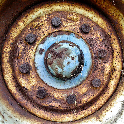 Hubsquircle Rusty tractor wheel hub. Scott Robinson Flickr