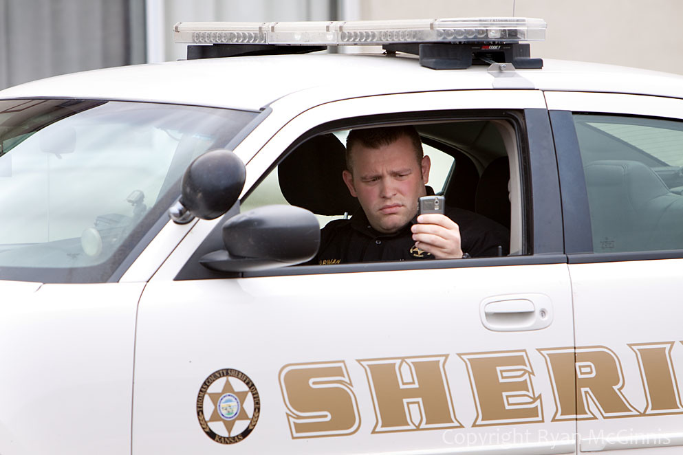 IMG_7300 A Salina, Kansas police officer takes a picture w… Flickr