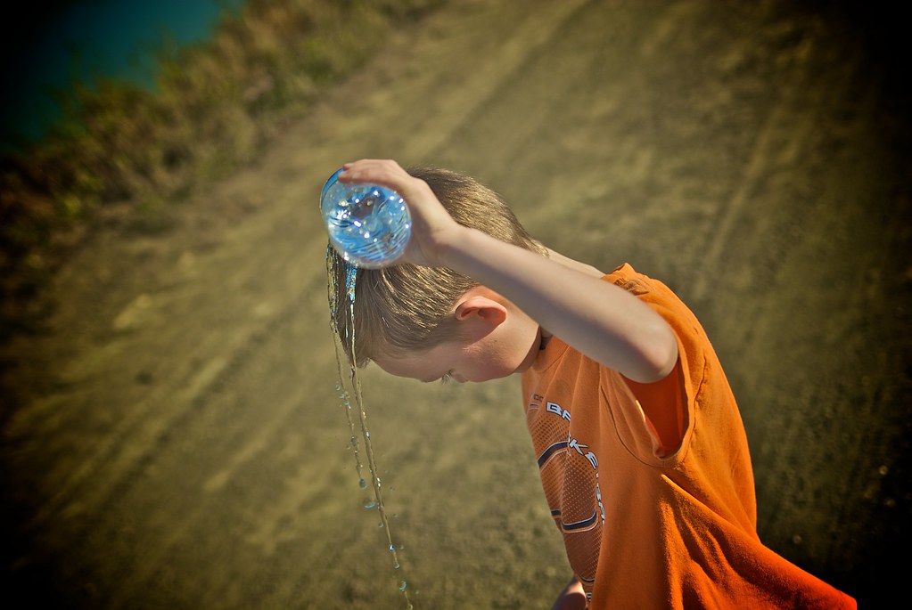 Pouring water on head Family walk in Alviso, California Flickr