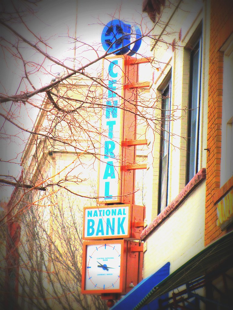 Interesting clock and sign Downtown Lawrence, Kansas. Flickr