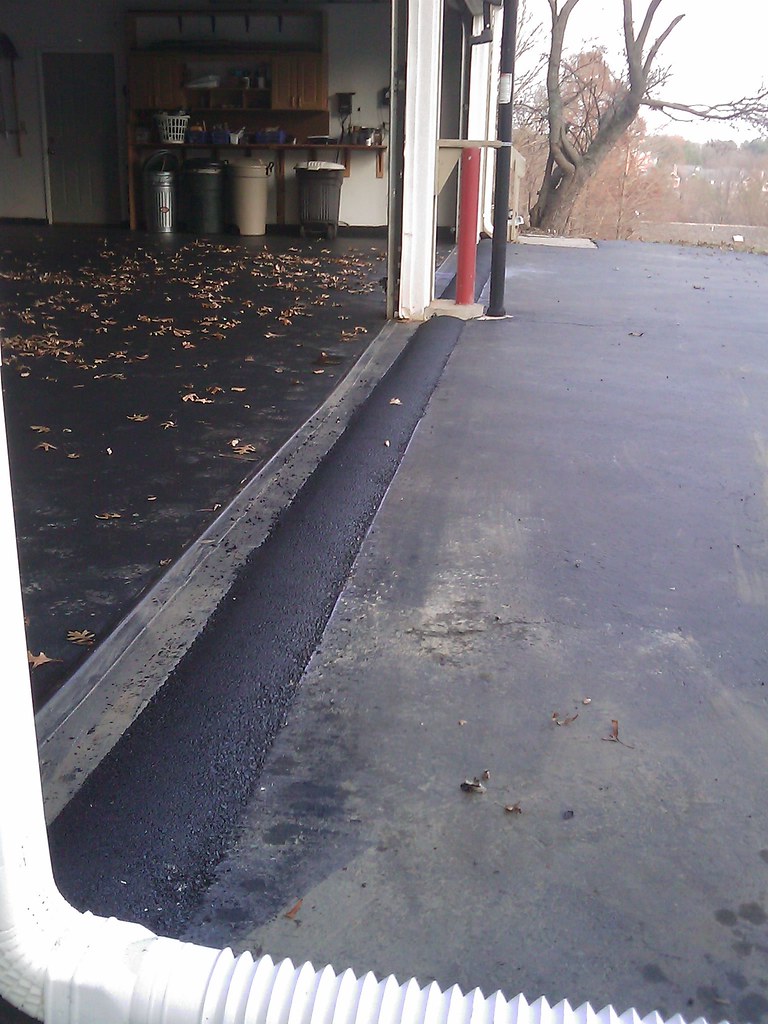 Water diversion Bump constructed at garage door made of ho… Flickr