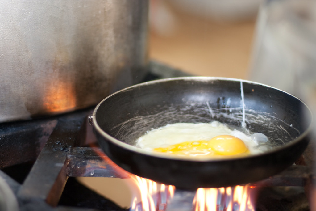 Fried egg An egg sizzles in the skillet at Abu Nawas Beach… Flickr