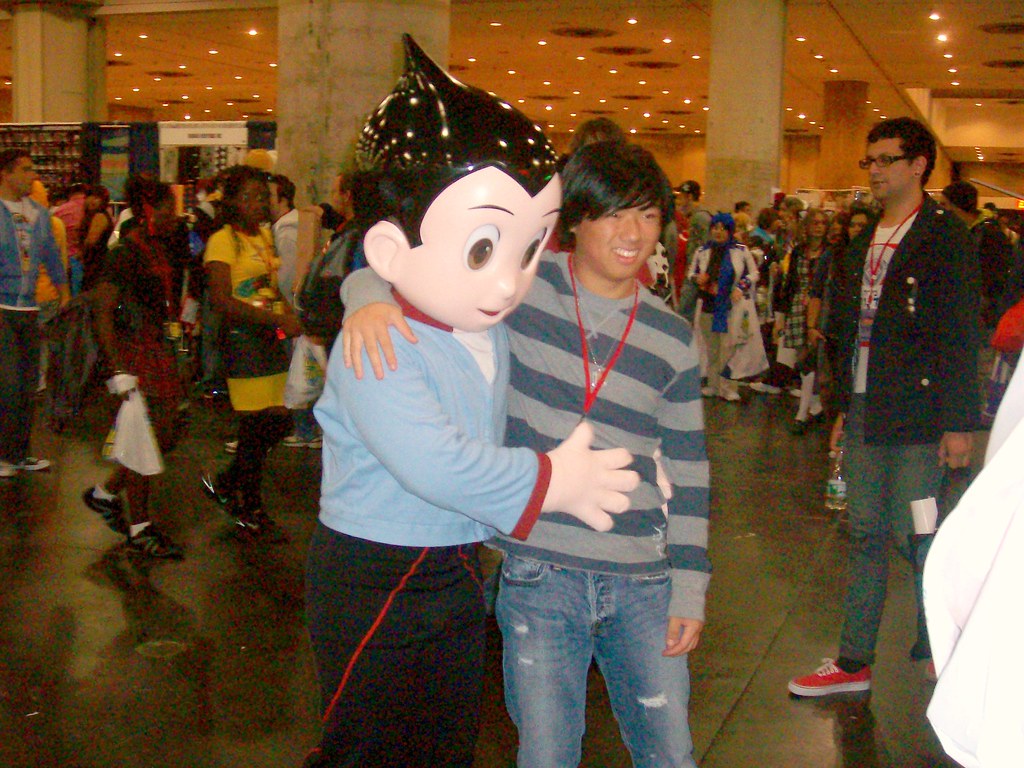Astro Boy Costume Guy in an Astro Boy costume pressing the… Flickr
