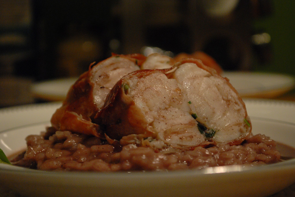 Monkfish wrapped in prosciutto on abed of red wine risotto… Flickr