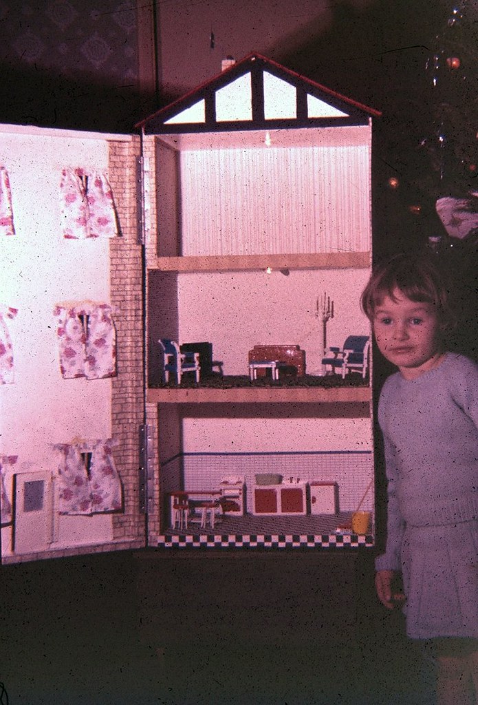 Girl shows her dolls house Tim Cornwell Flickr