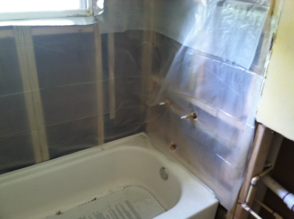 Vapor barrier Tub plumbing is done; now for the vapor barr… Flickr