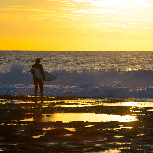 Sunset Surf Surfer on way back in to have final break of t… Flickr