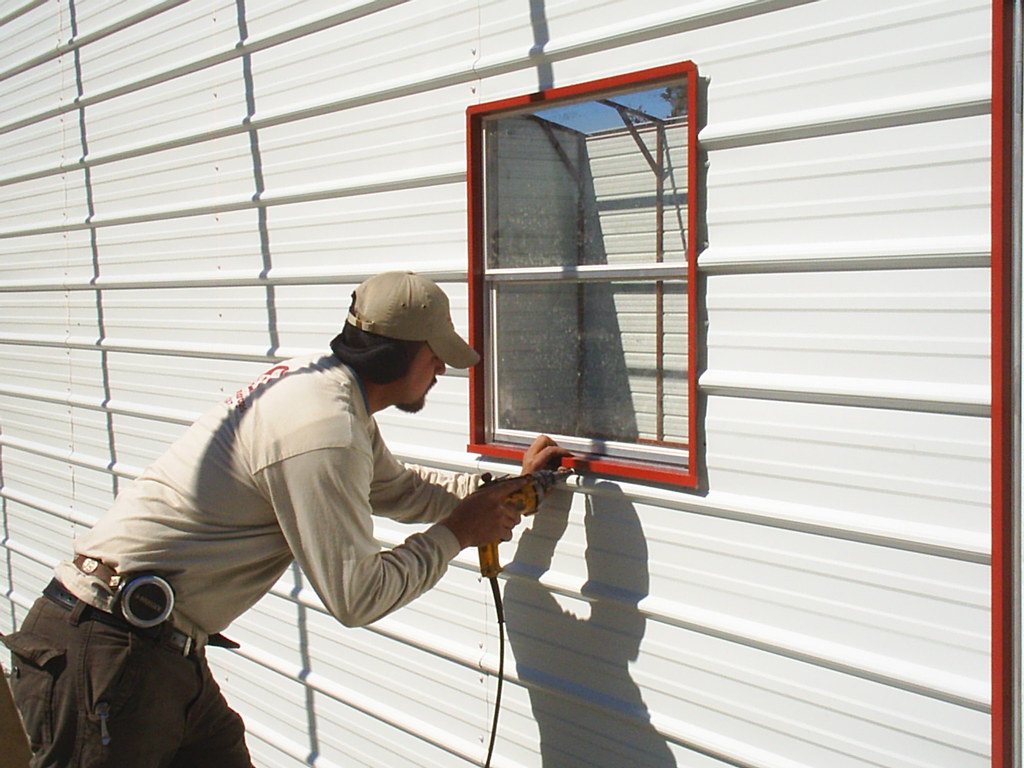 Window Installation in a Steel Building A technician secur… Flickr