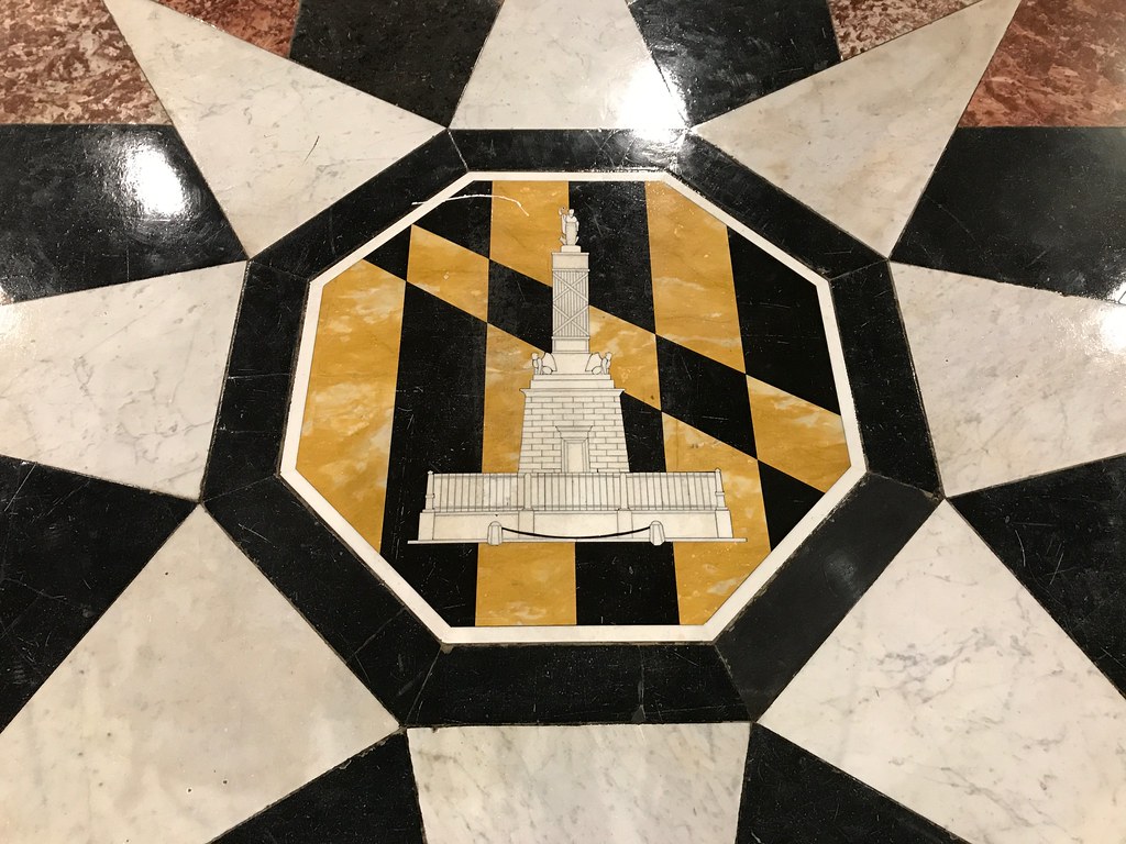 City seal on the floor in the interior of Baltimore City Hall, 100 N
