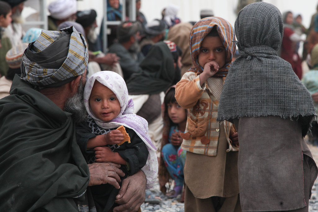 131122ACI200046 An Afghan family waits to receive care … Flickr