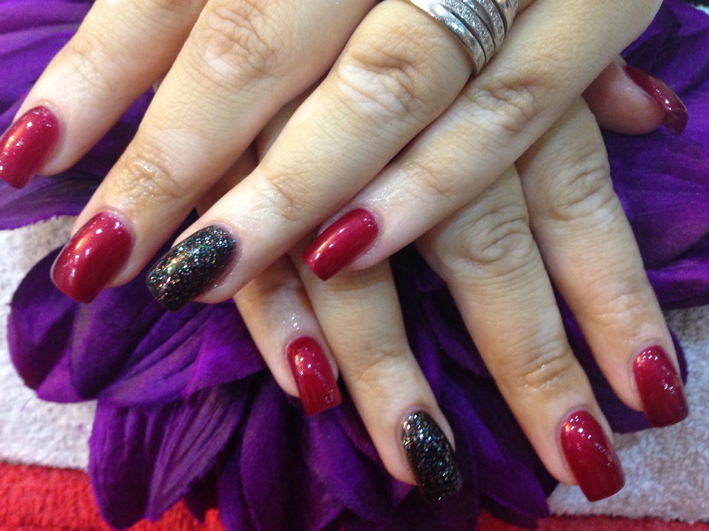 Black Nails With Glitter On Ring Finger