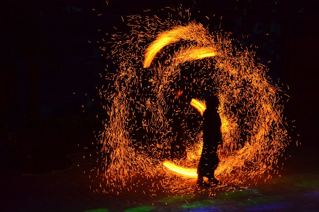 Tribal fire dance sparks flying! The dancers are fully ch… Flickr
