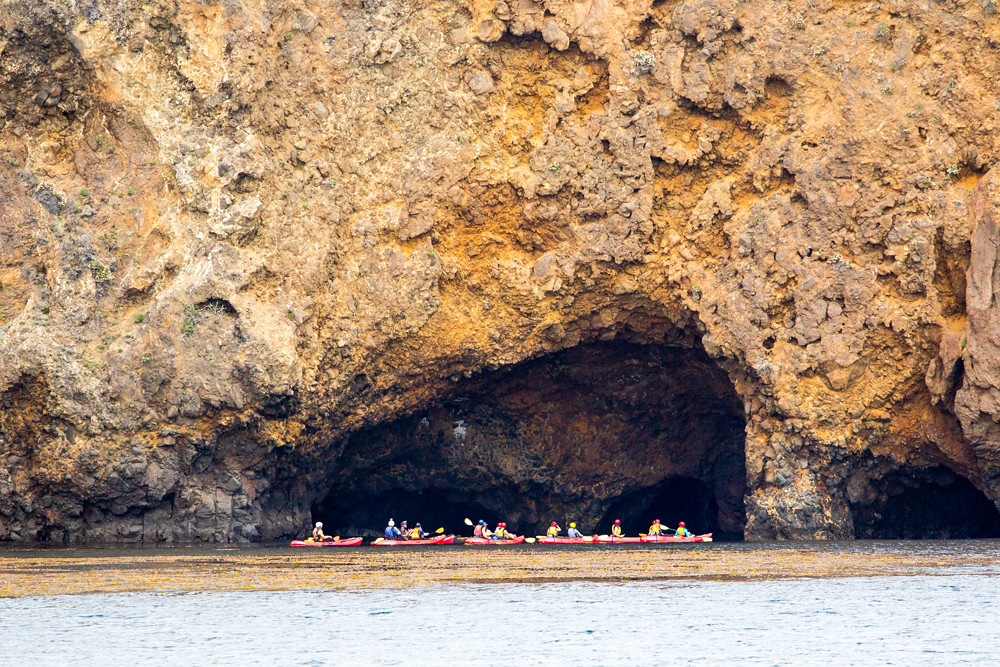 Kayaks exploring sea caves at Scorpion Anchorage, Santa Cruz Island